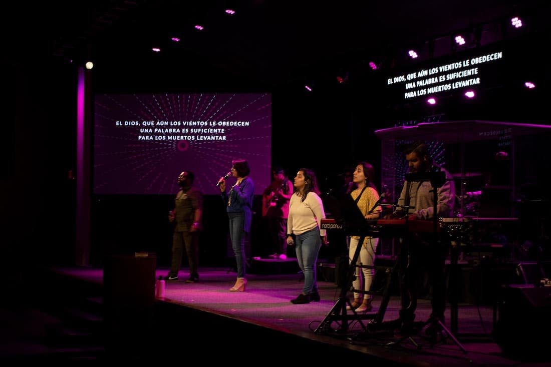 Church congregation singing to an audience
